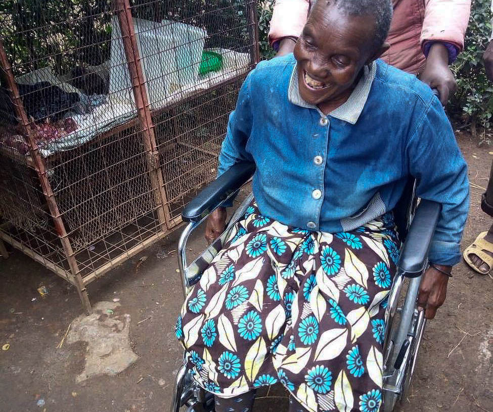 Tanzanian woman smiling big in her new wheelchair
